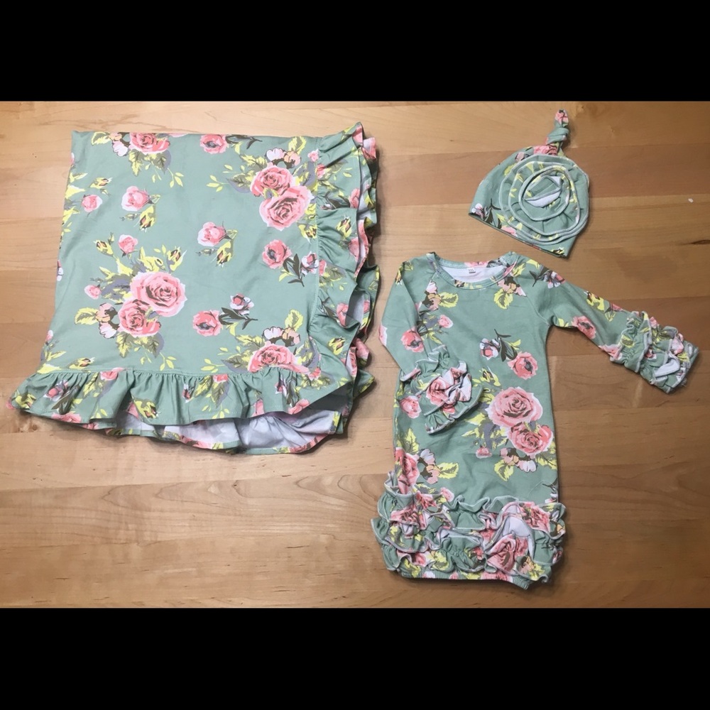 Newborn gown and hat with blanket.